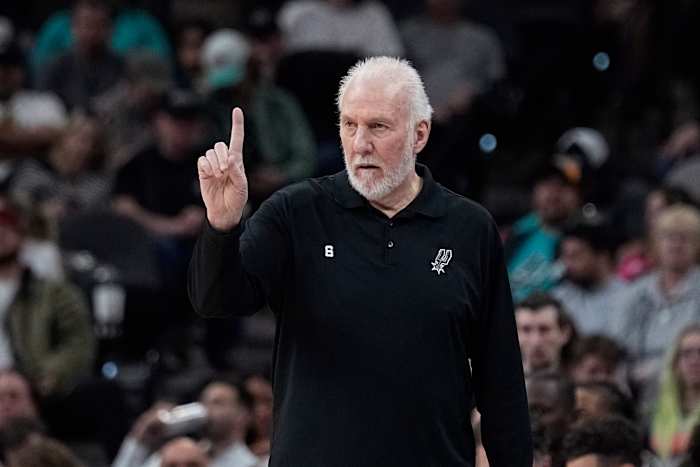 San Antonio Spurs head coach Gregg Popovich signals to his players during the second half.
